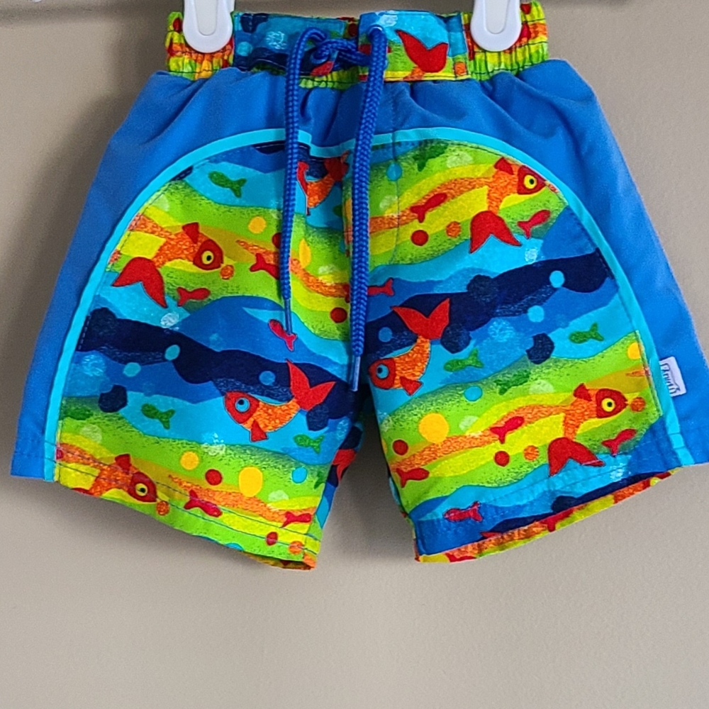 Brightly colored swim trunks with built in swim diaper